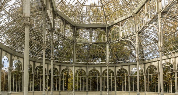Photo of Crystal Palace (Palacio de cristal) in the Retiro Park in Madrid. Spain. It was built in 1887 to exhibit flora and fauna from the Philippines. 