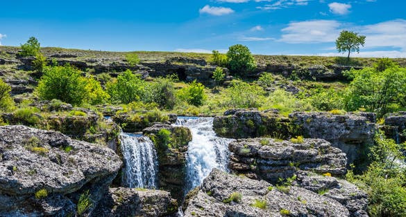 Photo of stunning waterfalls in rocky green scenery at Niagara falls landmark in Podgorica city, Montenegro.