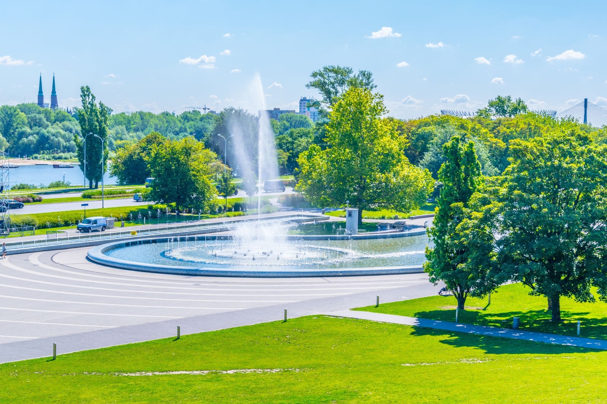 Photo of Multicolored fountain illuminated at night in Warsaw, Poland.