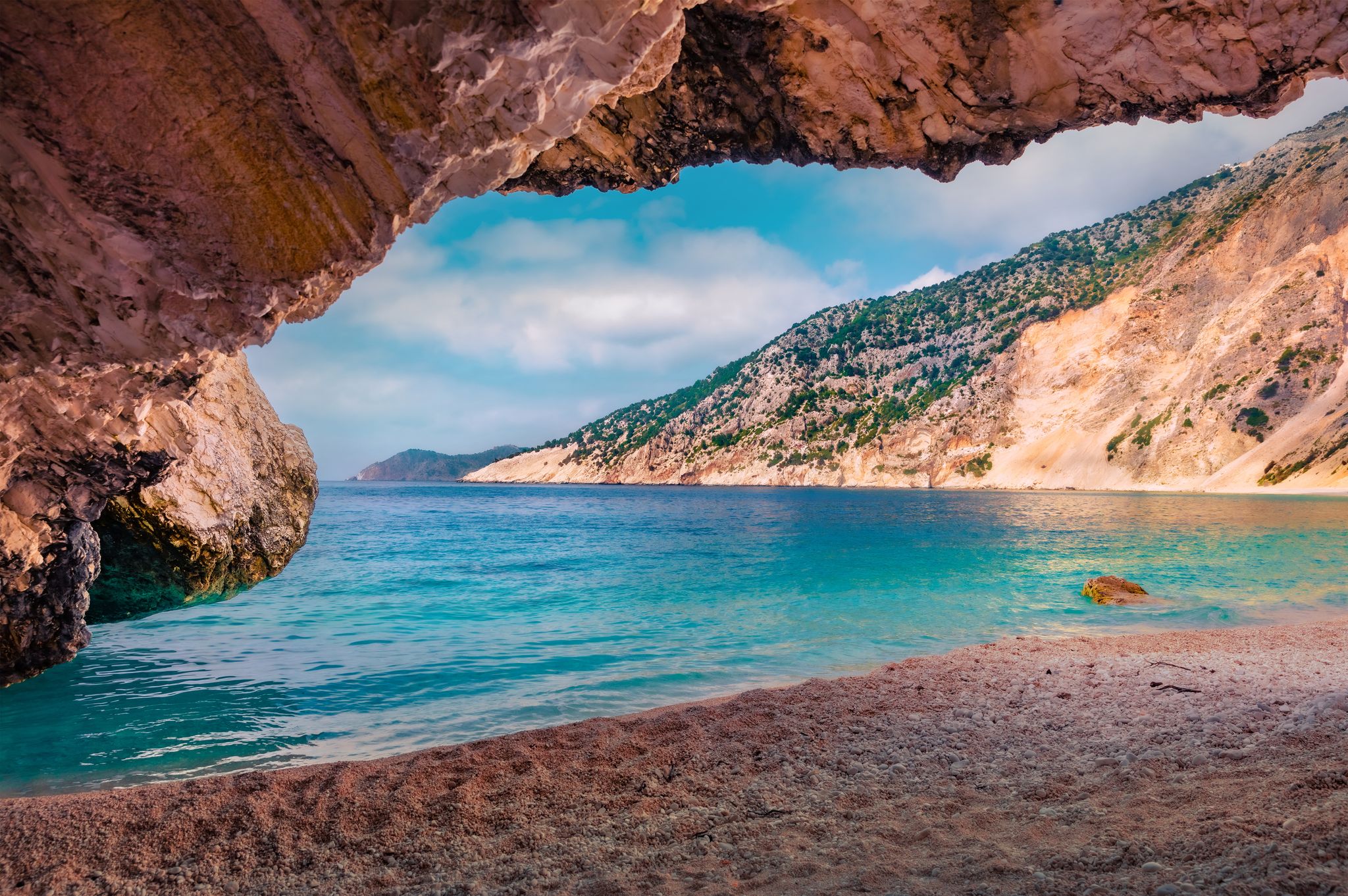 photo of View from the cave of Myrtos bay. Colorful morning scene of Cephalonia island, Divar Greece.ata village location, Greece, Europe. Astonishing summer seascape of Ionian Sea. Vacation concept background.,Divarata  