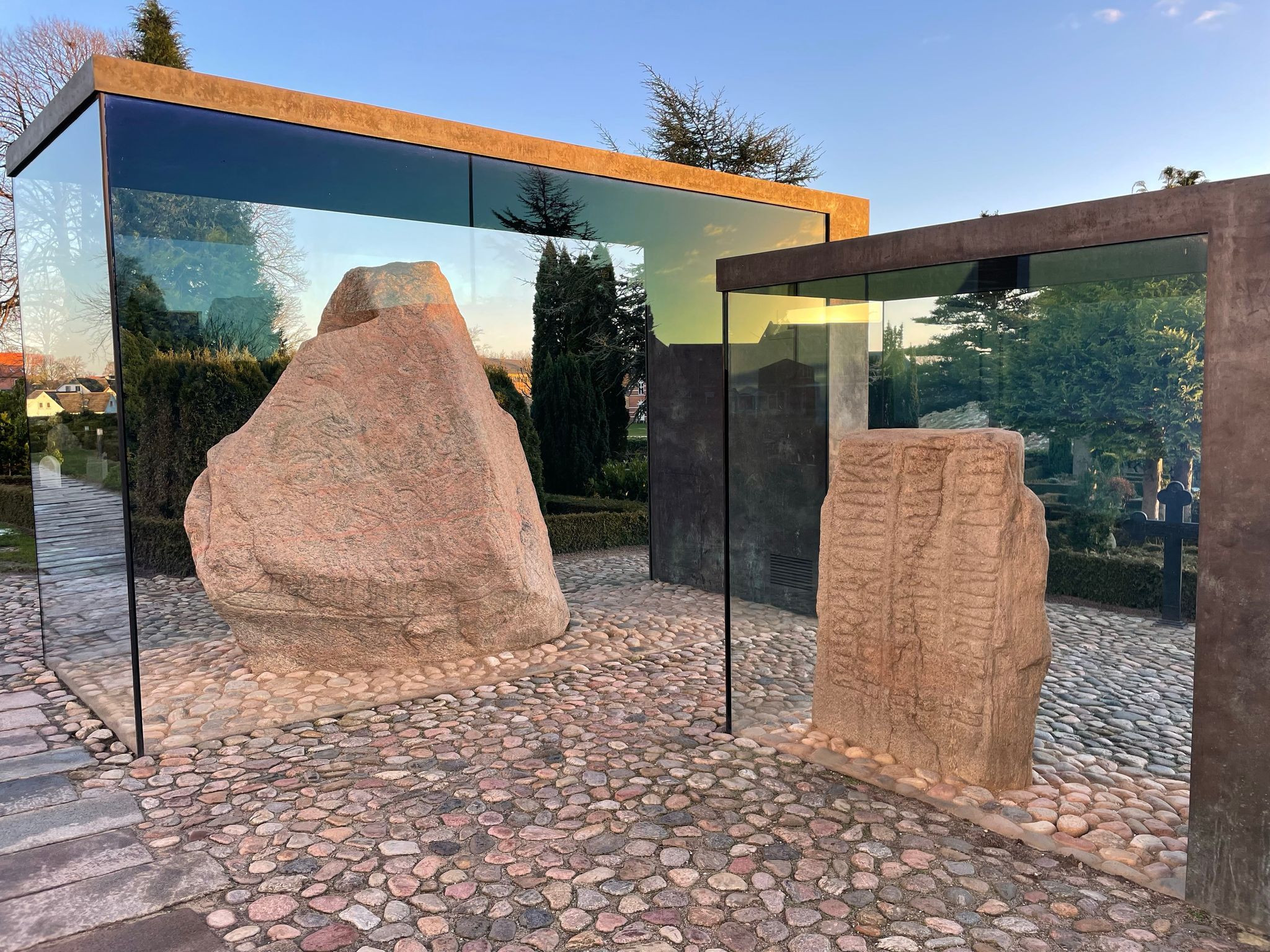 Photo of a large rock sculpture outside the Kongernes Jelling, Denmark.