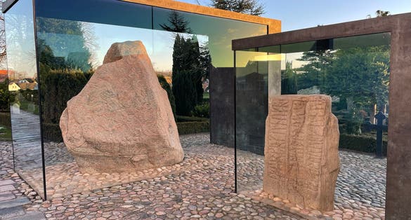 Photo of a large rock sculpture outside the Kongernes Jelling, Denmark.
