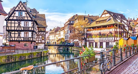photo of Traditional half-timbered houses on picturesque canals in La Petite France in the medieval fairytale town of Strasbourg, UNESCO World Heritage Site, Alsace, France.