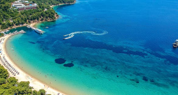 Photo of aerial view over Koukounaries beach in Skiathos island.