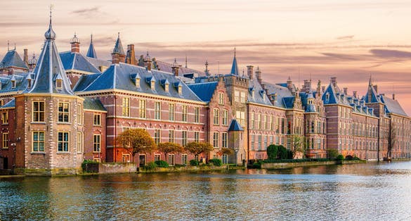 photo of the Hague, Binnenhof with the Hofvijver lake at sunset. Meeting place of states general of the Netherlands, the ministry. Office of the prime minister of Netherlands.