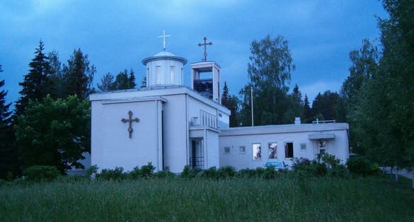 Photo of the Lintulan Pyhän Kolminaisuuden luostari at night, Palokki, Heinavesi, Finland.
