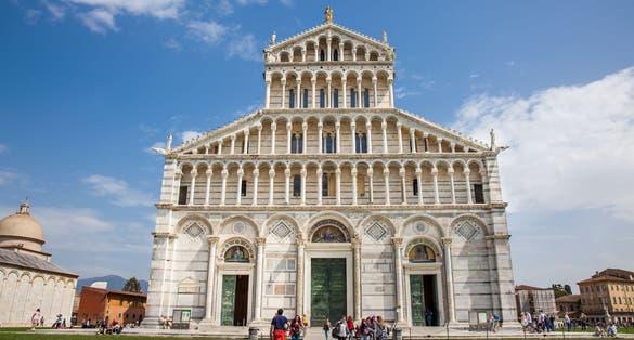 Photo of Tourists at the Primatial Metropolitan Cathedral of the Assumption of Mary in Pisa.