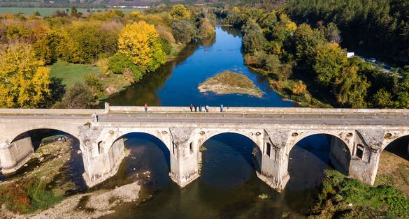 Aerial view of Nineteenth-century bridge over the Yantra River, known as the Kolyu Ficheto Bridge in Byala, Ruse region, Bulgaria