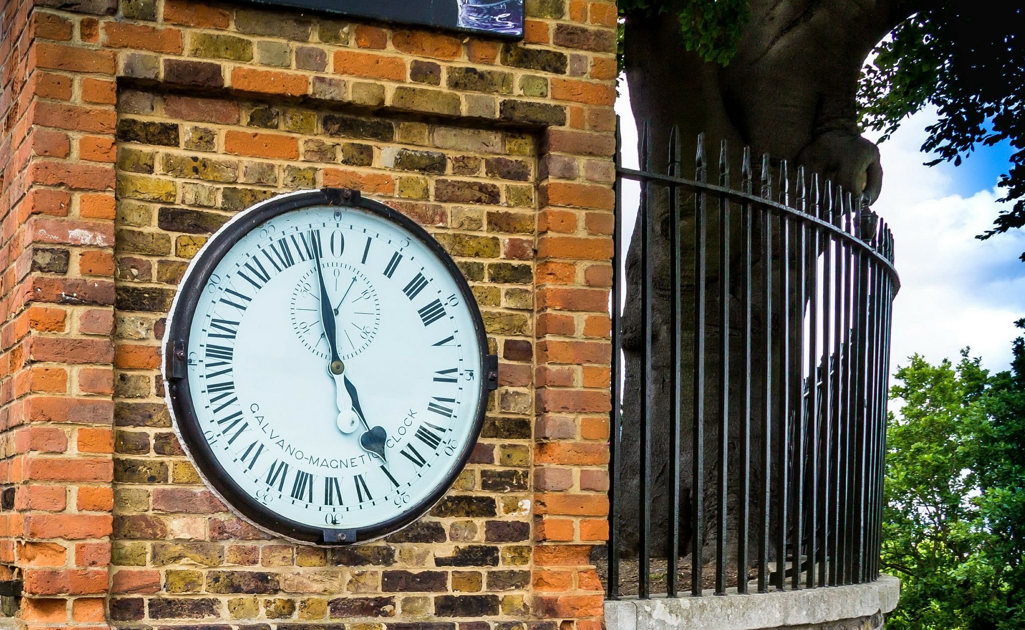 Photo of Shepherd gate clock at Royal Greenwich Observatory in London, UK.