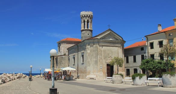 Photo of Embankment, church and beacon. Piran, Slovenia.