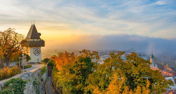 Photo of famous clock tower on Schlossberg hill in Graz, Austria.