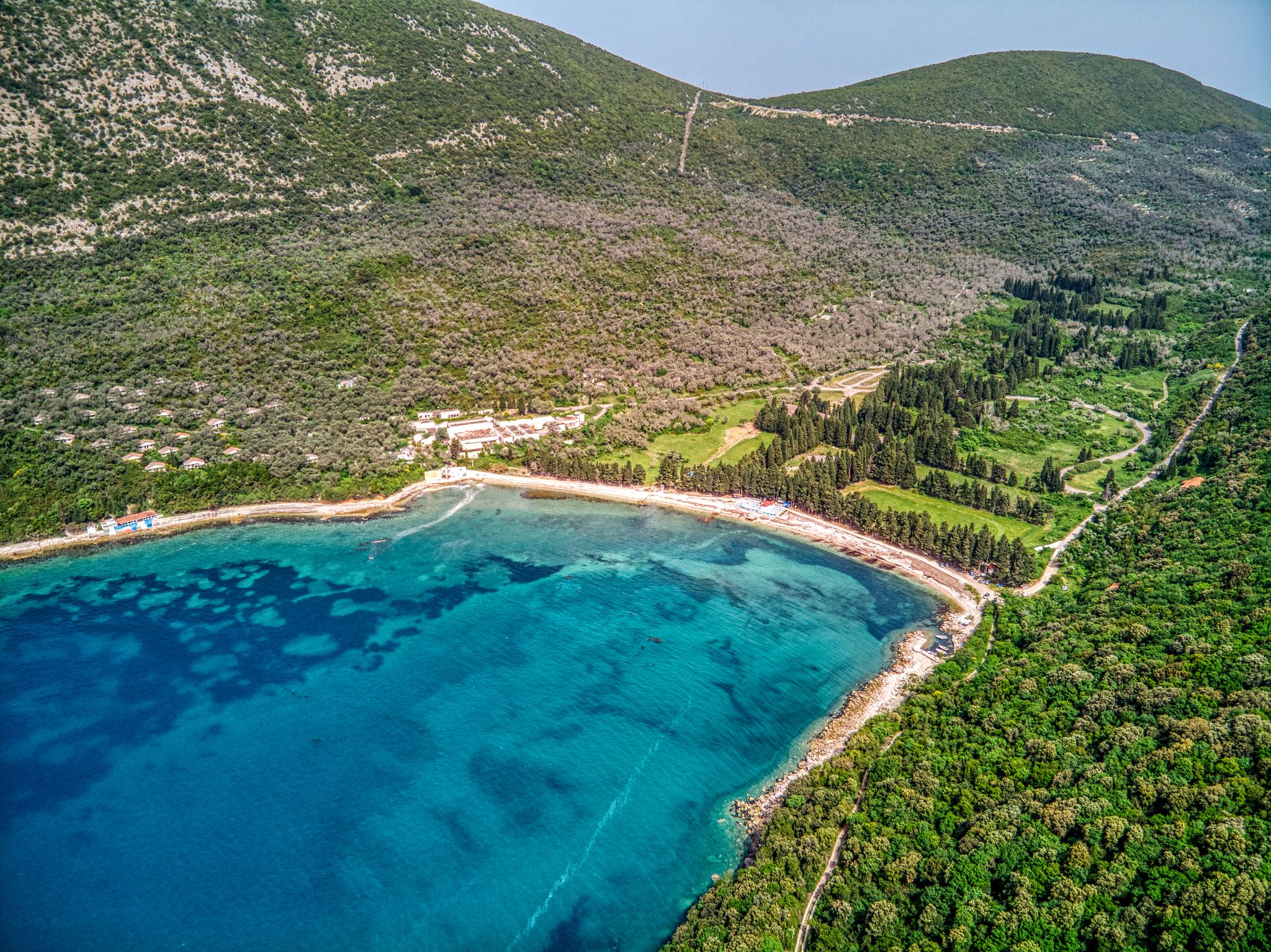 Photo of aerial view of Valdanos beach near Ulcinj, Montenegro. Beautiful bay with transparent water and breathtaking landscapes.