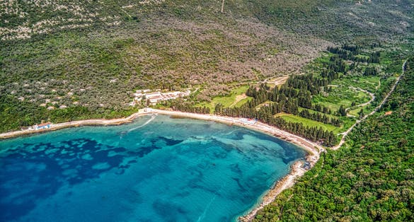 Photo of aerial view of Valdanos beach near Ulcinj, Montenegro. Beautiful bay with transparent water and breathtaking landscapes.