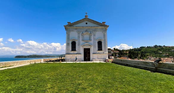 Photo of The church of saint george, piran, slovenia, europe.