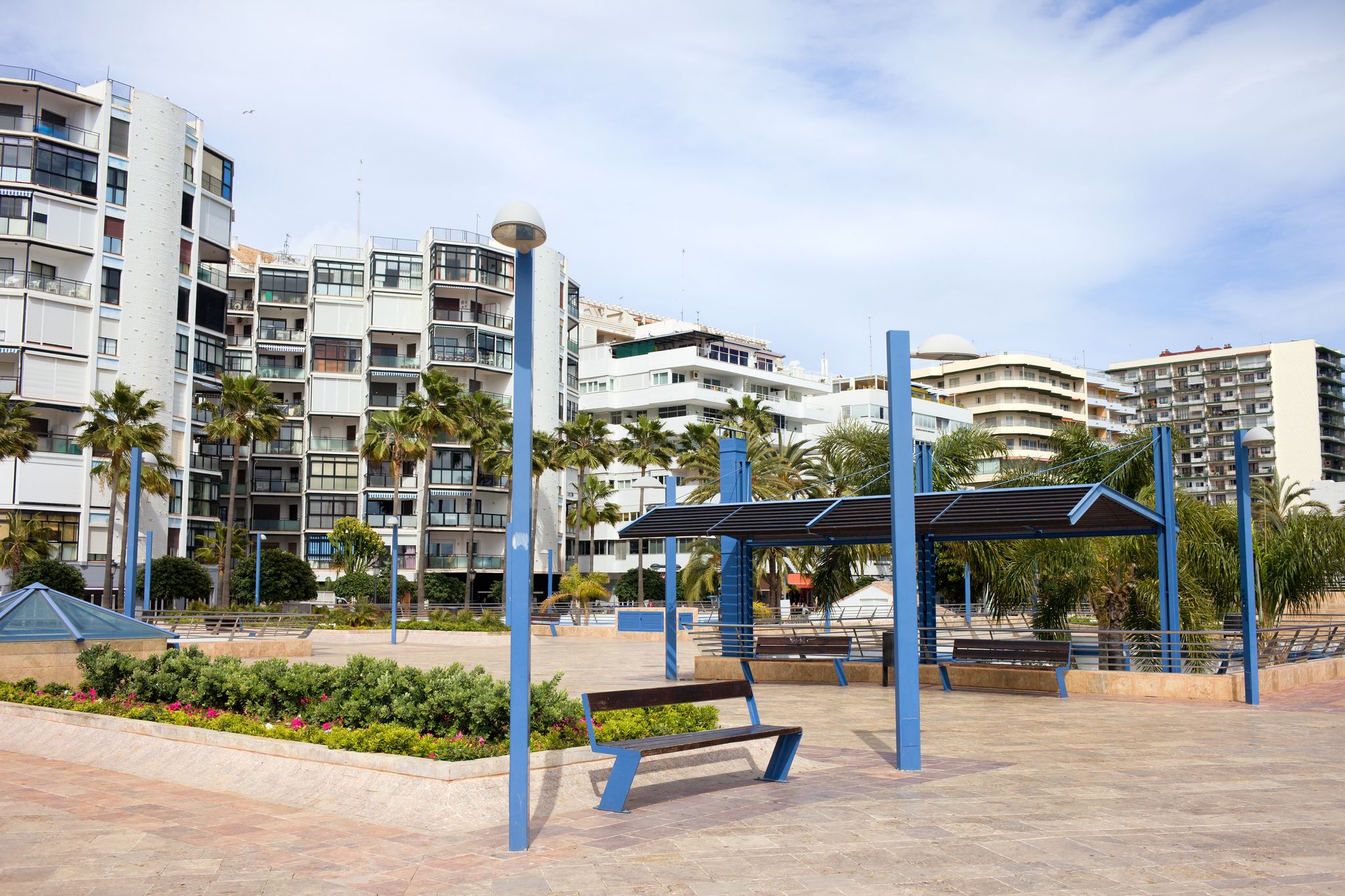 Photo of Cobbled square and apartment houses on the Avenida del Mar in Marbella, Costa del Sol, Spain .