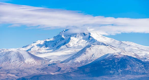photo of clouds on a volcanic Mount Erciyes is reaching a height of 3,864 m it the highest mountain and most voluminous volcano in Kayseri, Turkey.