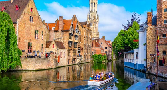 Classic view of the historic city center with canal in Brugge (Bruges), West Flanders province, Belgium. Cityscape of Bruges.