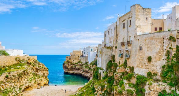 View of the beach lama monachile cala porto in the italian city polignano a mare.
