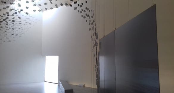 Photo of the interior of Wadden Sea Centre the final room in the exhibition features an artwork of glass with video projections showing the flight of birds, Denmark.