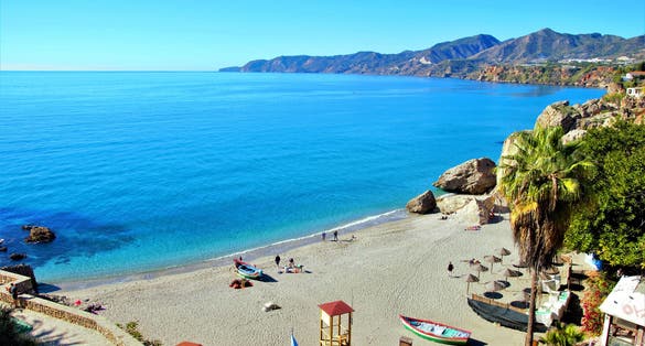 Photo of tourist spaces in the town of Nerja, Málaga, one of the white villages of Andalusia, Spain, Calahonda beautiful beach.