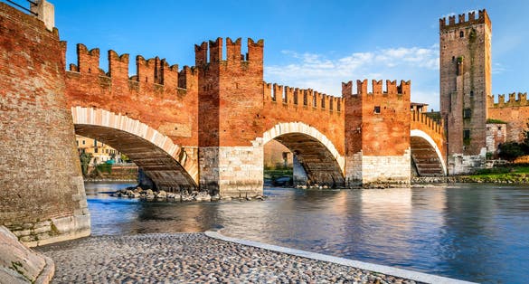 photo of view of Verona, Italy. Scenery with Adige River and Ponte Scaligero and Castelvecchio, medieval landmarks of veronese city, Verona, Italy.