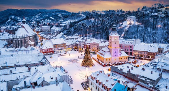 Photo of Brasov, Romania. Winter Christmas aerial view of Council Square and Christmas Tree, Transylvania landmark, Eastern Europe .