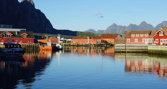 Photo of Scenic view of the waterfront harbor and traditional houses in Svolvaer in summer. 
