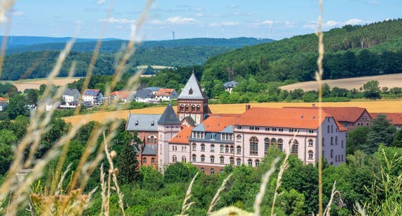 Photo of the mission house with church and the landscape of the Sankt Wendler,Germany.
