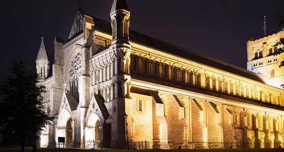 Photo of popular tourist St Albans abbey church in night lights illumination in London, England, United Kingdom.