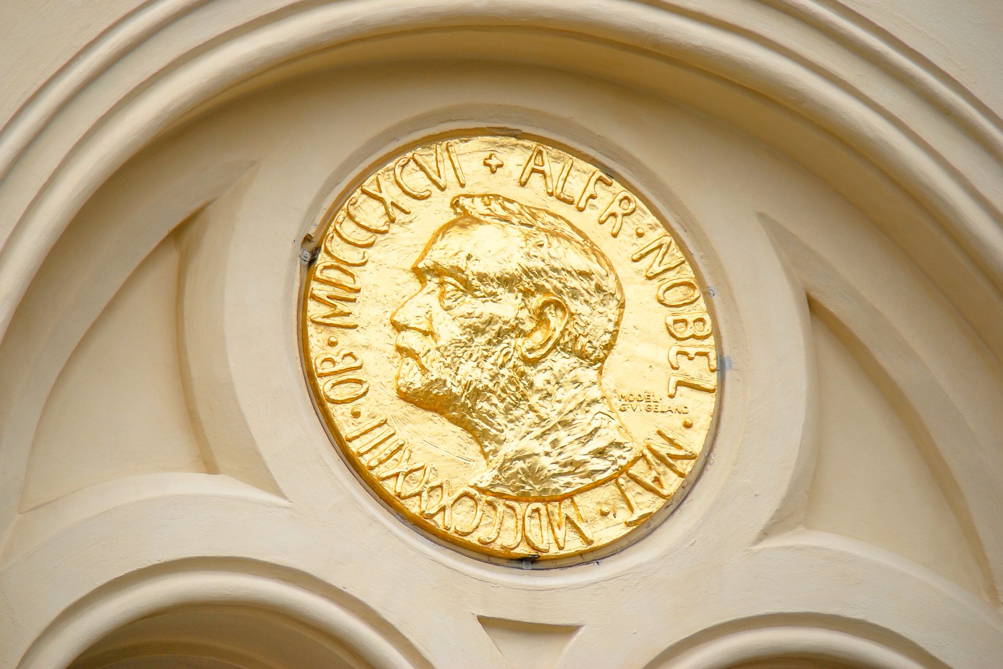 Facade detail of the Nobel Peace Center in Oslo, Norway decorated with an enlarged copy of the Nobel Peace Prize medal.