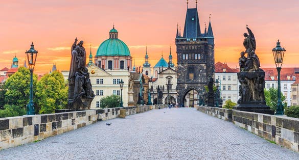 Photo of Prague, Czech Republic. Charles Bridge and Old Town Tower at sunrise.