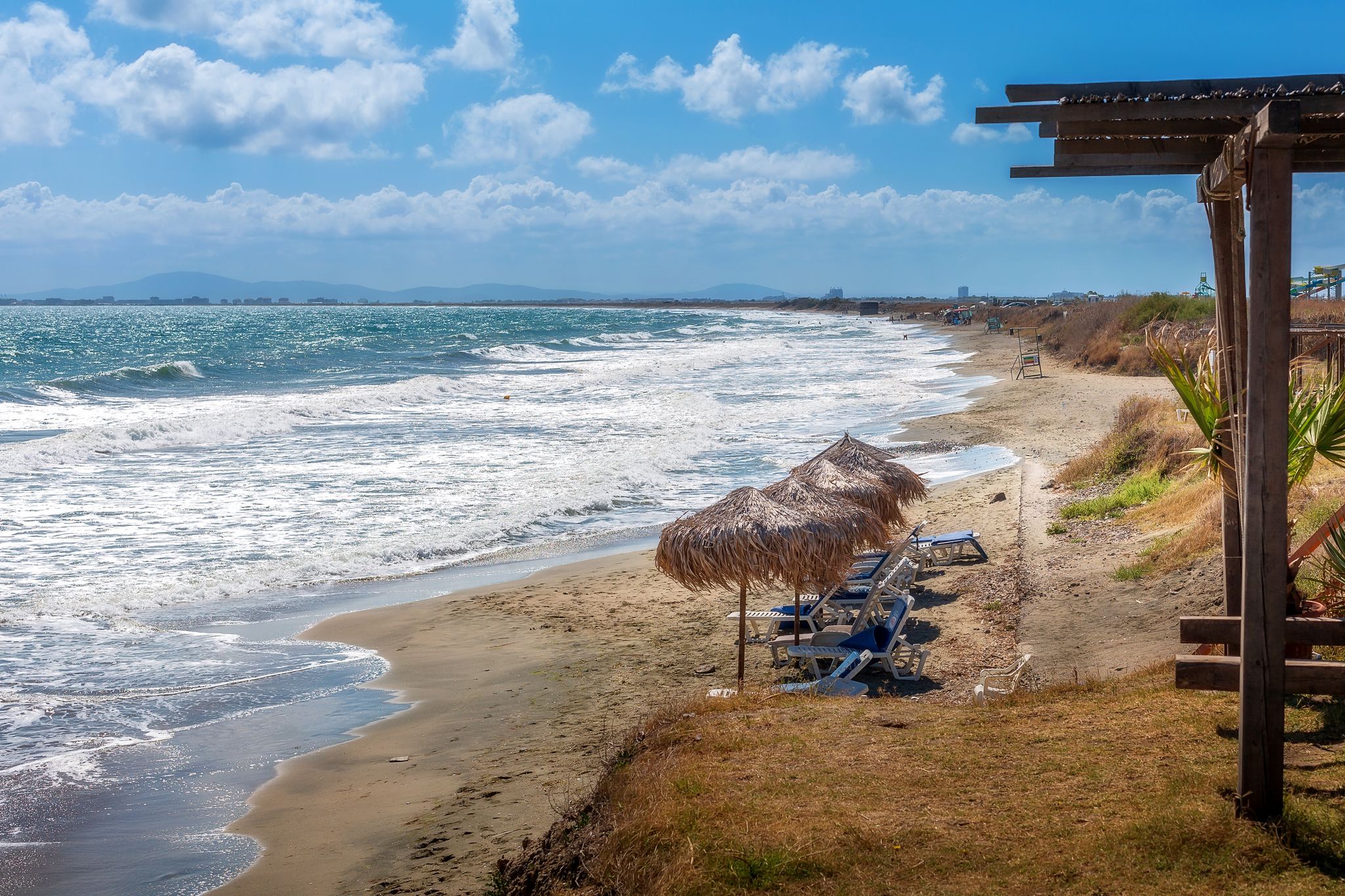 Aheloy, Bulgaria sandy beach panorama with unbrellas on the Black Sea near