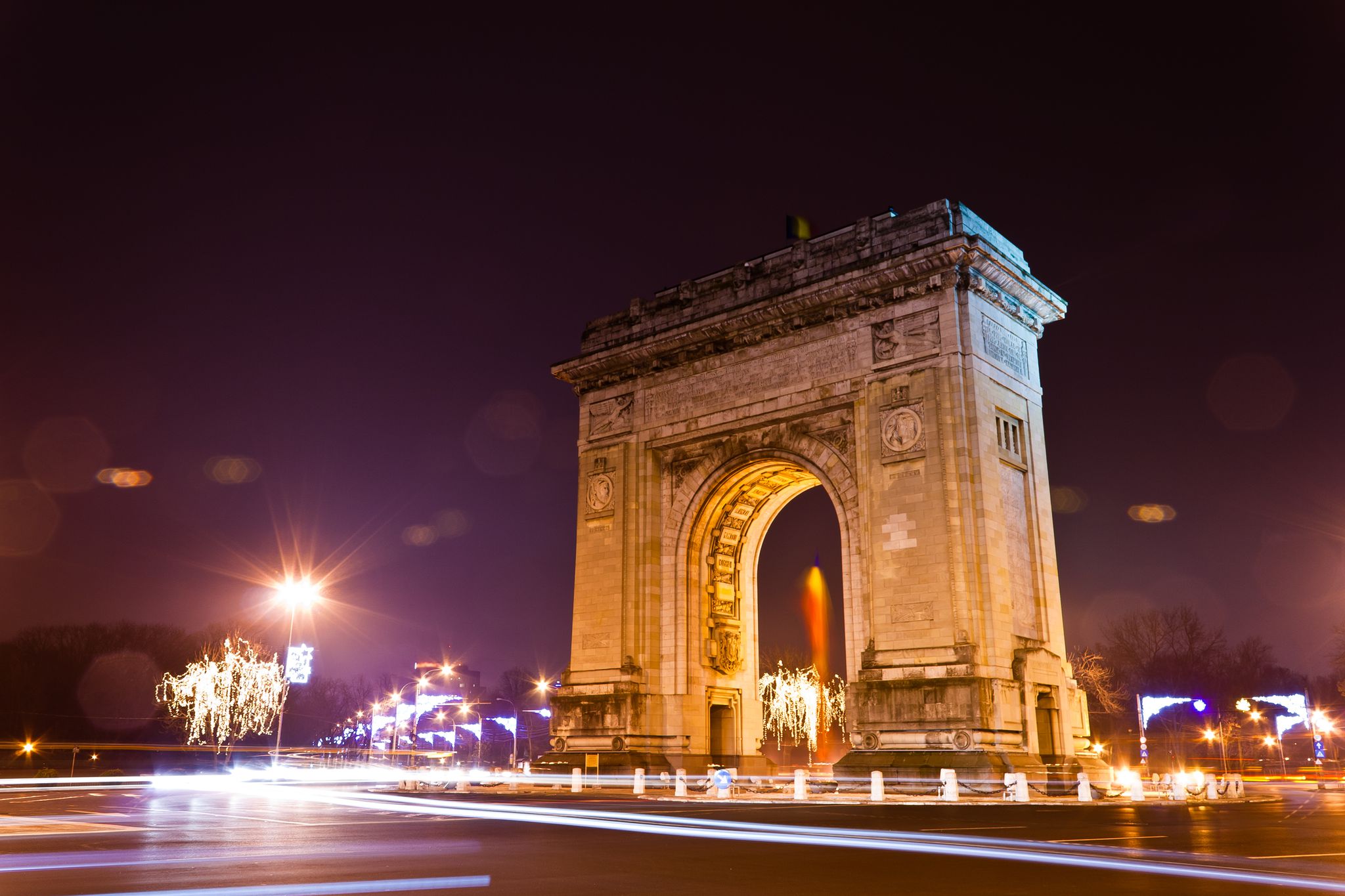 Photo of Arc De Triomphe in the night, Bucharest, Romania.