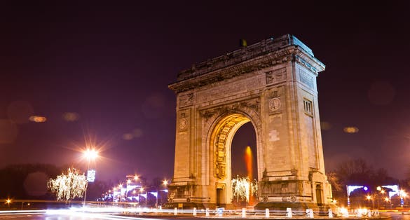 Photo of Arc De Triomphe in the night, Bucharest, Romania.
