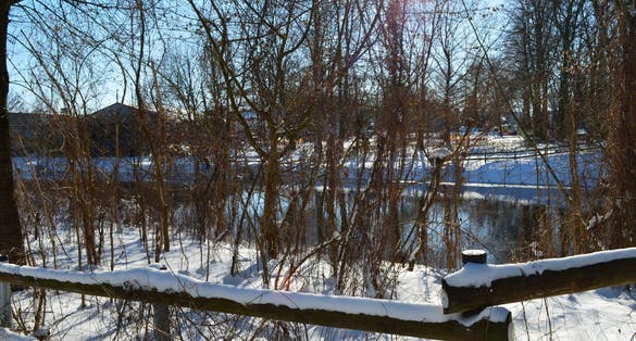 Photo of snow and ice landscape in winter. Ems River and Emssee in Warendorf Germany.