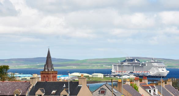 photo of landscape of the island of Kirkwall in the background cruise ship MSC in Scotland.