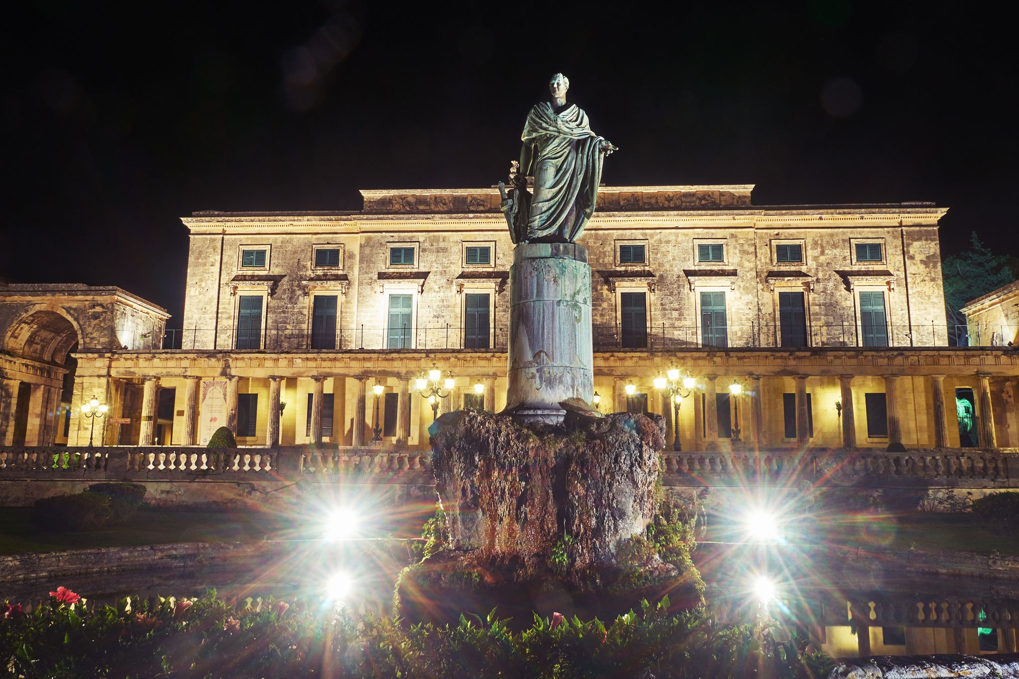 PHOTO OF Statue of Sir Frederick Adam in front of the Palace and museum of asian art of Corfu City on the island of Corfu, Greece .