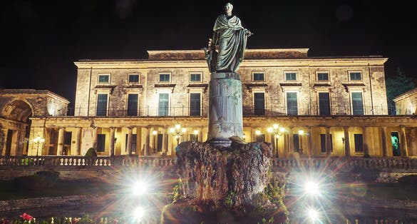 PHOTO OF Statue of Sir Frederick Adam in front of the Palace and museum of asian art of Corfu City on the island of Corfu, Greece .