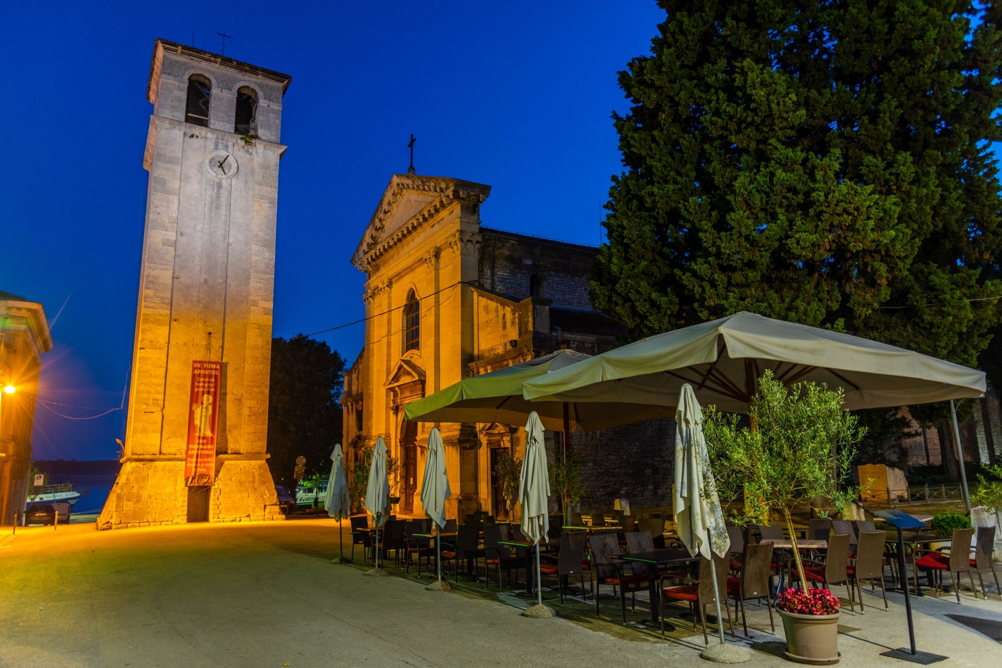 Photo of Cathedral of the Assumption of the Blessed Virgin Mary with clock tower at night in Pula city in Croatia.