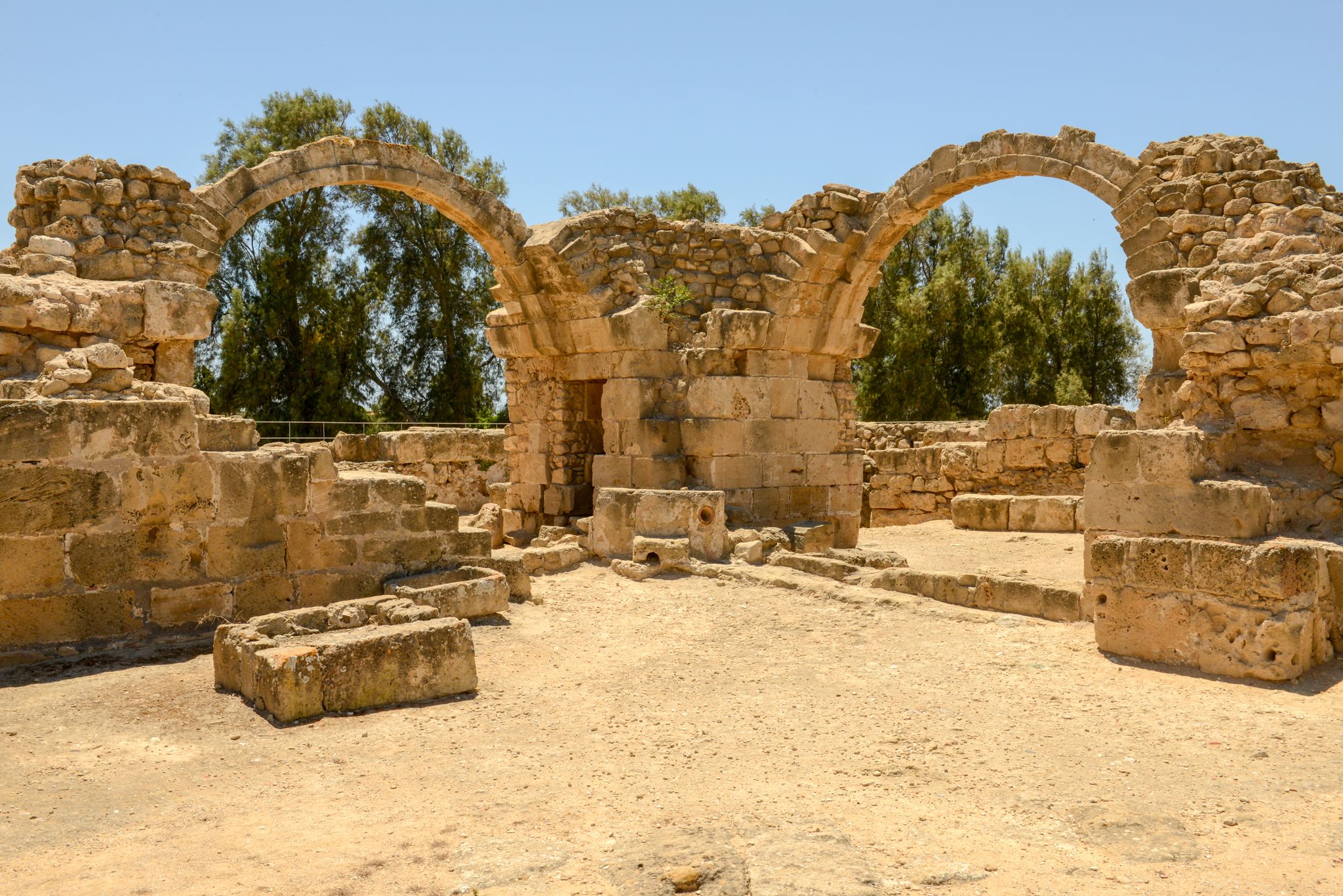 Photo of the arches of Saranta Kolones castle the medieval fortress built on the site of an earlier Byzantine fort. Paphos Archaeological Park, Cyprus.