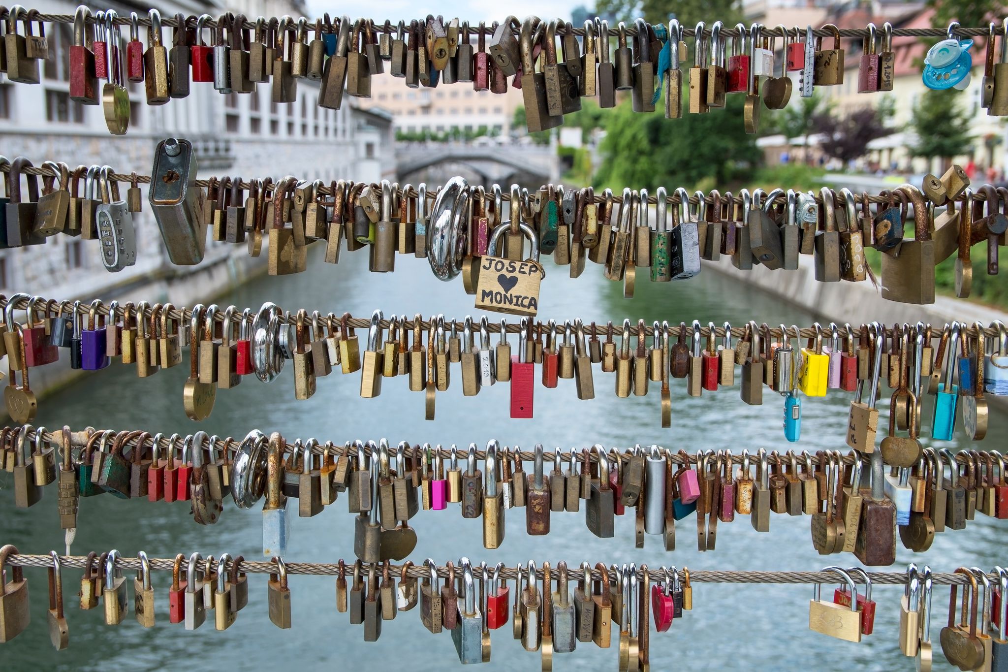 Photo of Love locks on Butcher's Bridge and Triple Bridge in Ljubljana, capital of Slovenia.