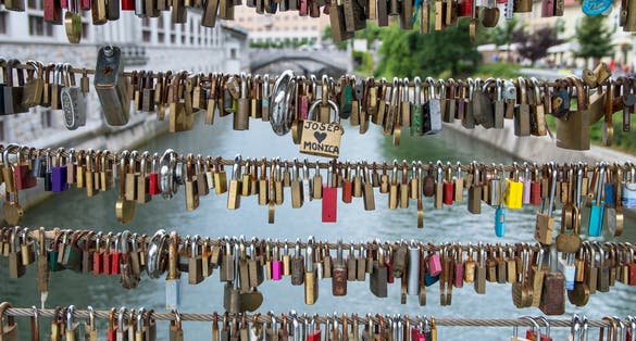 Photo of Love locks on Butcher's Bridge and Triple Bridge in Ljubljana, capital of Slovenia.