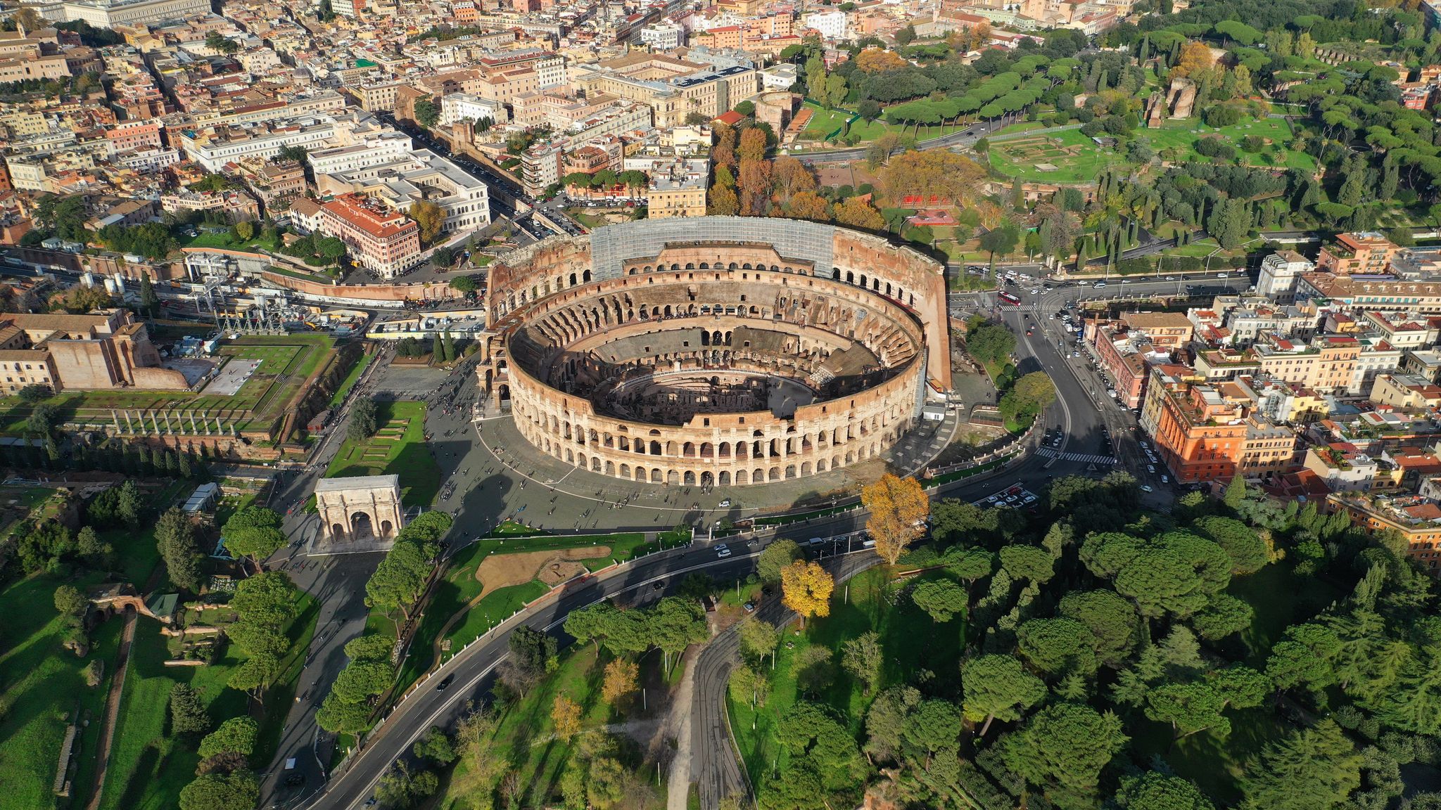 photo of aerial drone photo of iconic ancient Roman gladiatorial arena world famous colosseum, Rome historic center, Italy.