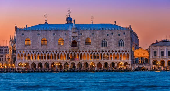 photo of Night view of piazza San Marco and Doge's Palace (Palazzo Ducale) in Venice, Italy. Architecture and landmark of Venice. Night cityscape of Venice .