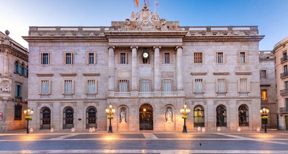 Photo of Casa de la Ciutat, City Hall of Barcelona on the Placa de Sant Jaume in The Gothic Quarter of Barcelona during morning blue hour, Spain.