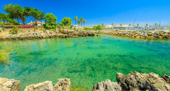 Photo of Cascais Marina with boats on distance. Summer season with blue sky.