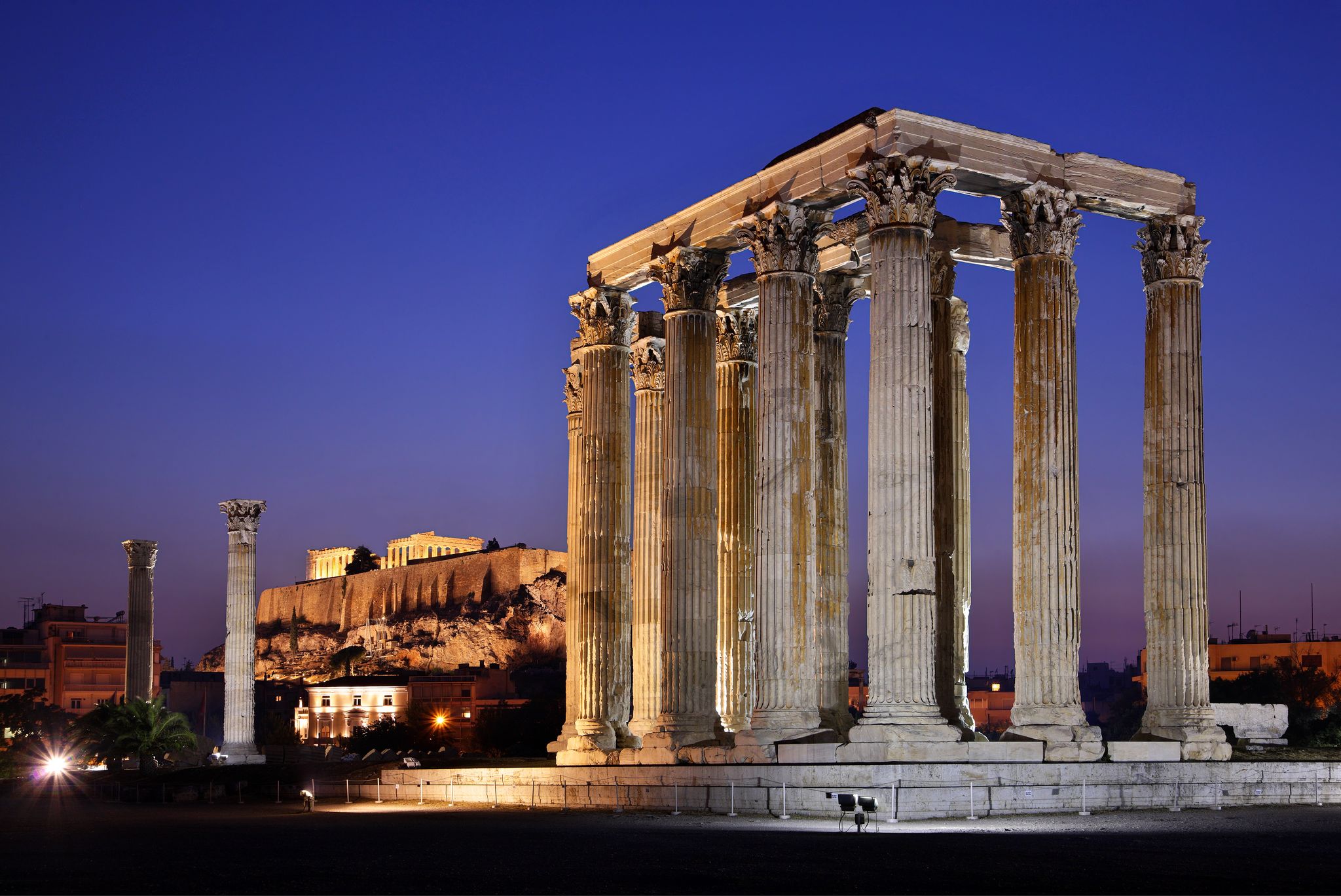 Photo of The Temple of Olympian Zeus (considered one of the biggest of the ancient world) in the "blue" hour, with Acropolis in the background.