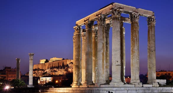 Photo of The Temple of Olympian Zeus (considered one of the biggest of the ancient world) in the "blue" hour, with Acropolis in the background.