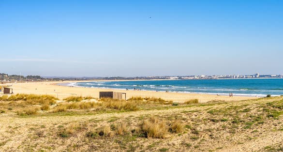 Tourism at Meia Praia in Lagos in the Algarve Portugal.