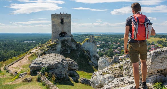 Young traveler exploring ruins of the Olsztyn castle located in the Polish Jura within the Eagles' Nests Trail, Olsztyn, Poland